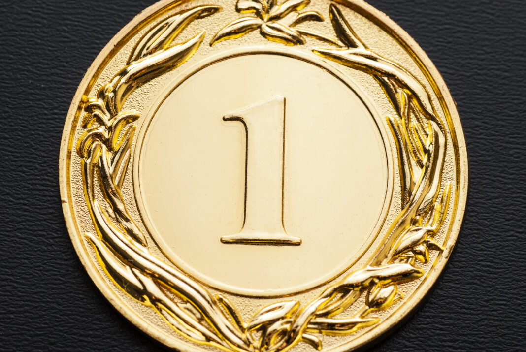 Close-up of a golden medal for the number one